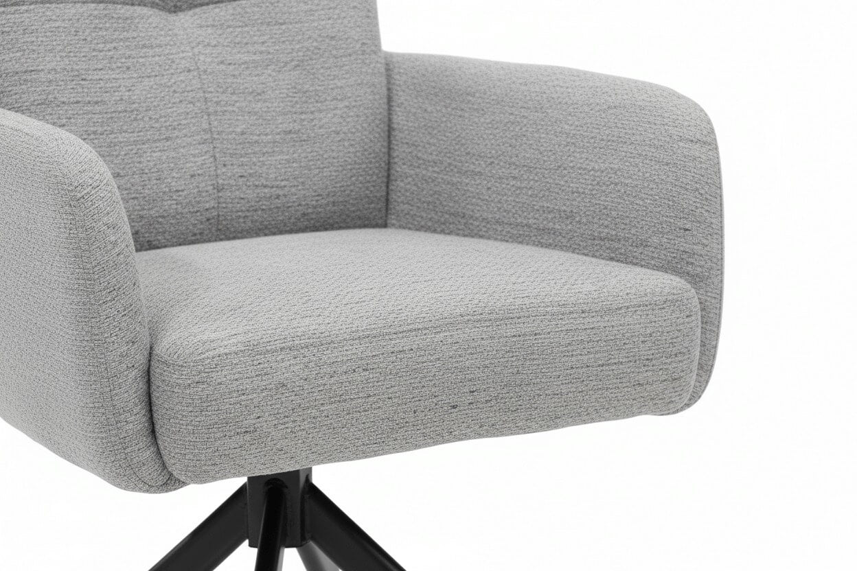 Close-up van de RV Design Fred armstoel met comfortabele zitting en armleuningen, hoogwaardige stofstructuur en zwarte metalen draaivoet.