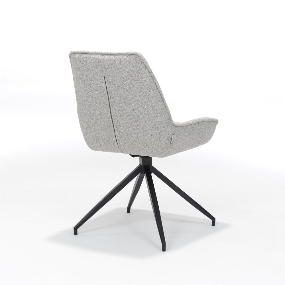 Achteraanzicht van RV Design Montana stoel met teddy bekleding in taupe en zwart metalen draaivoet.