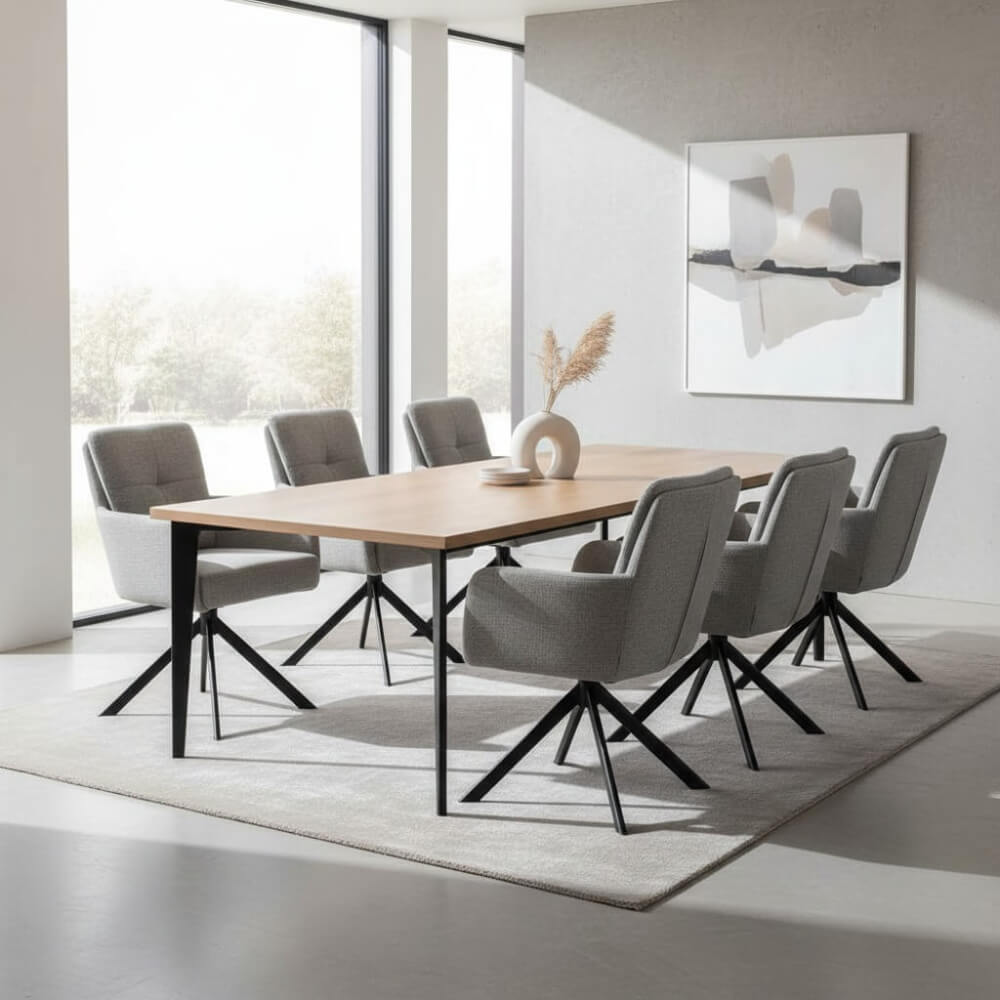 Zes RV Design Fred armstoelen in grijze stof rond een lange houten eettafel in een modern interieur met natuurlijke lichtinval.